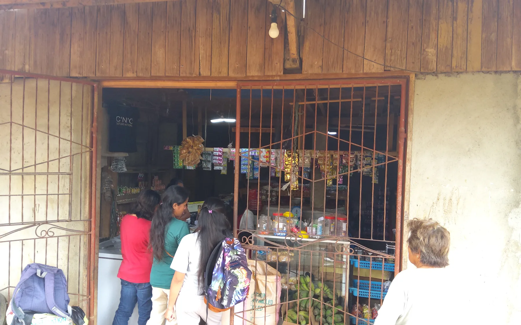 Customers visiting the BMMPC consumer store stocked with everyday goods